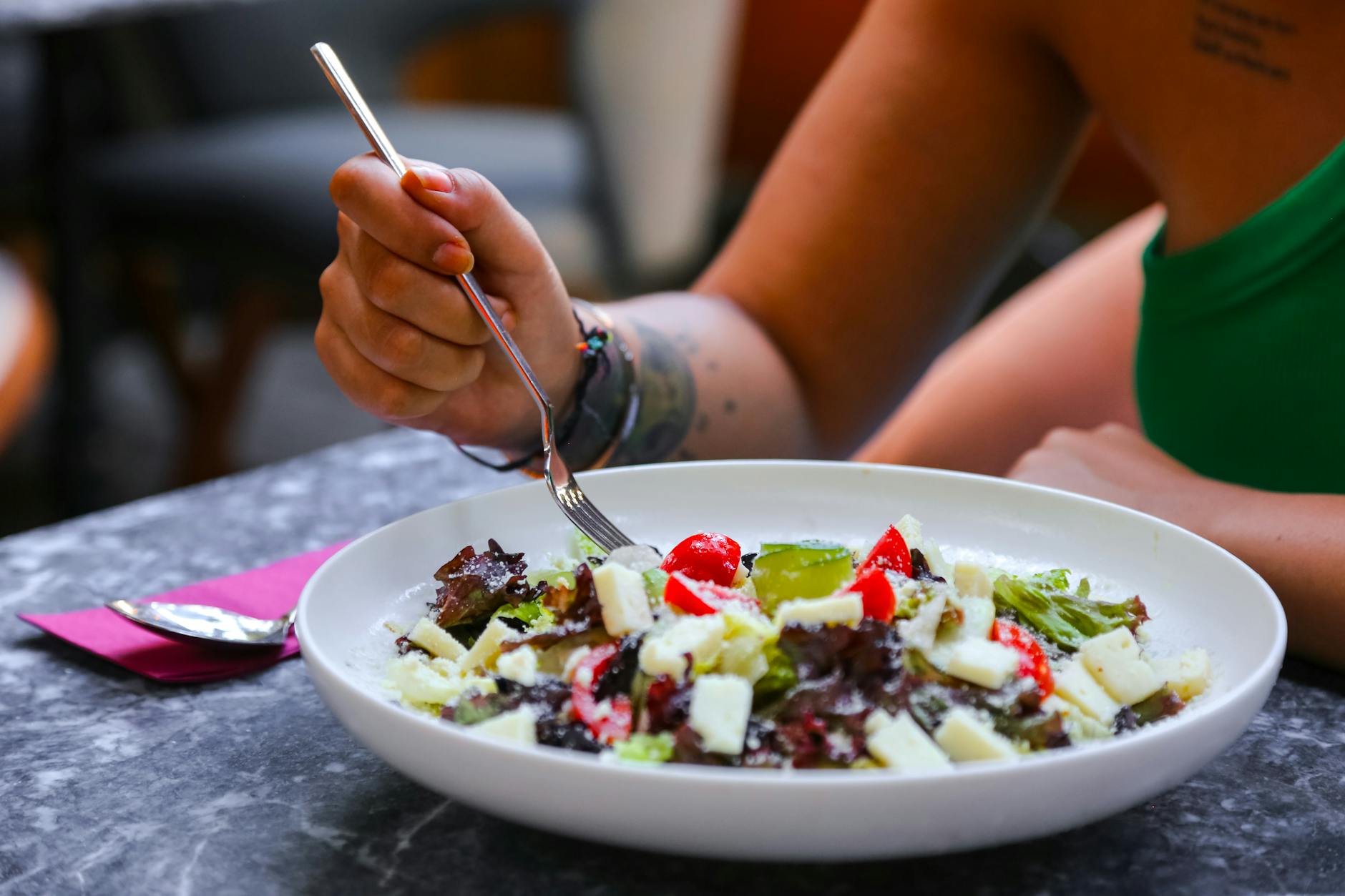 Woman enjoying a blood sugar-friendly lunch as part of a prediabetes meal plan