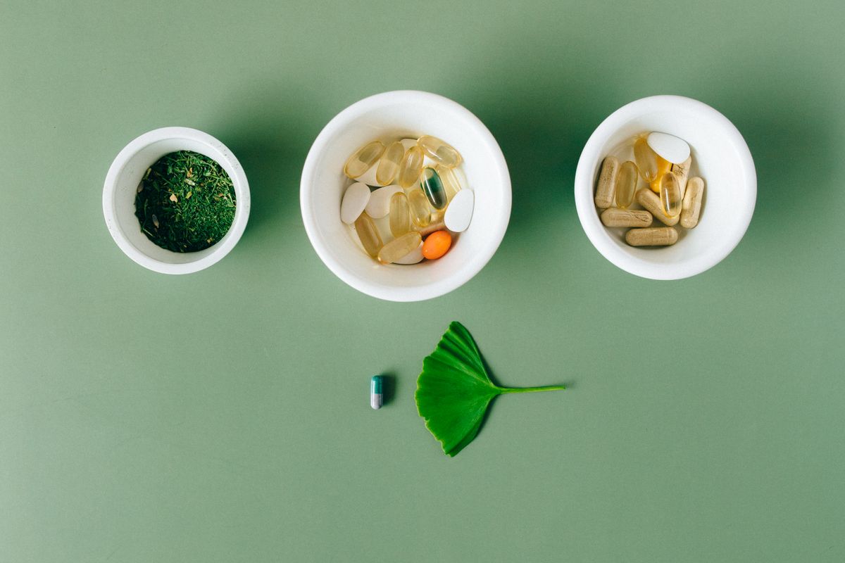 Natural supplement capsules arranged on a clean surface, representing blood sugar support options