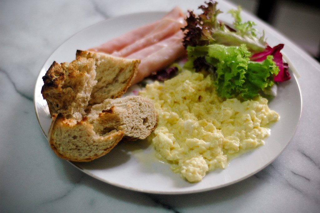 older person eating early healthy dinner