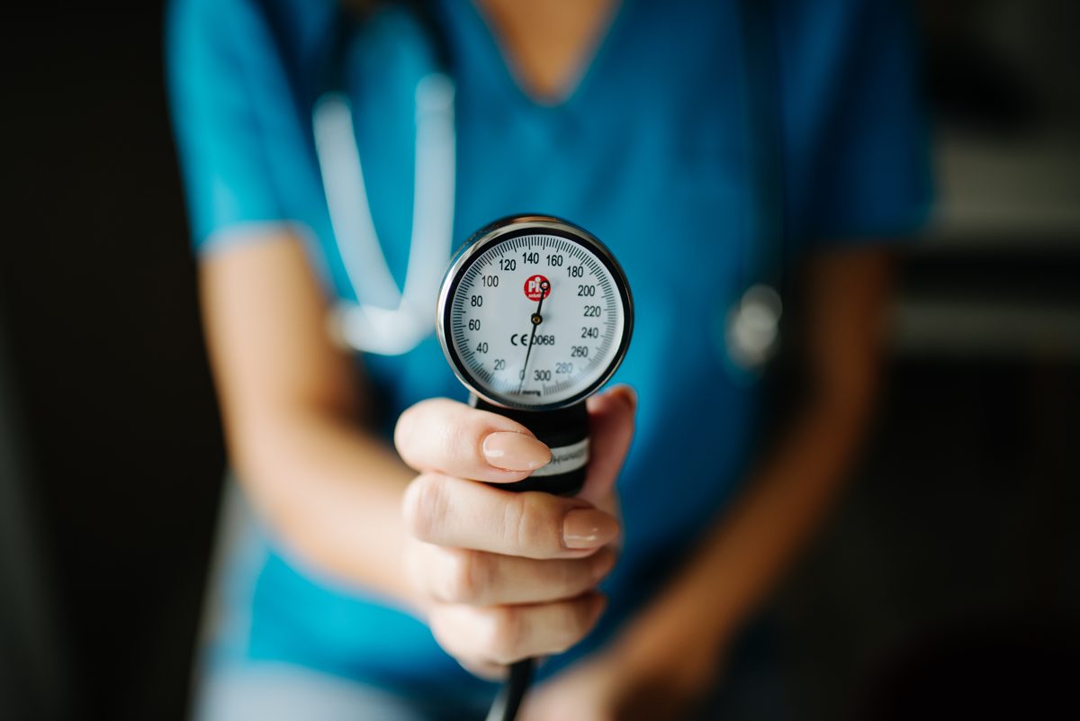 doctor showing blood test results to older patient