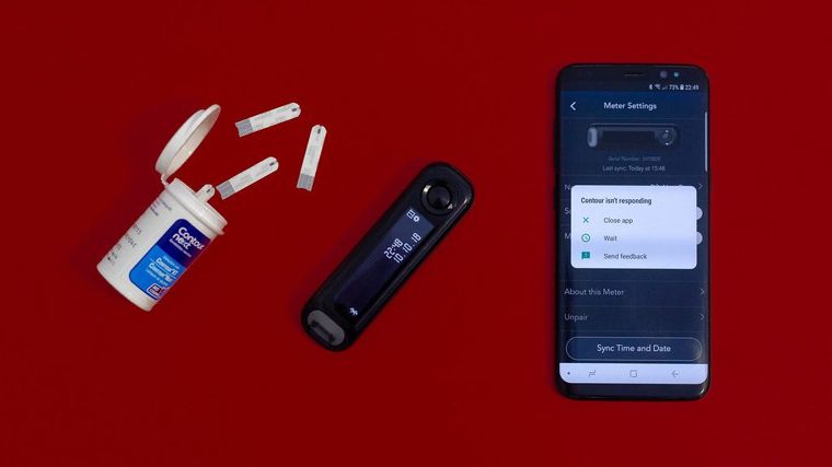 glucose meter and healthy food on table